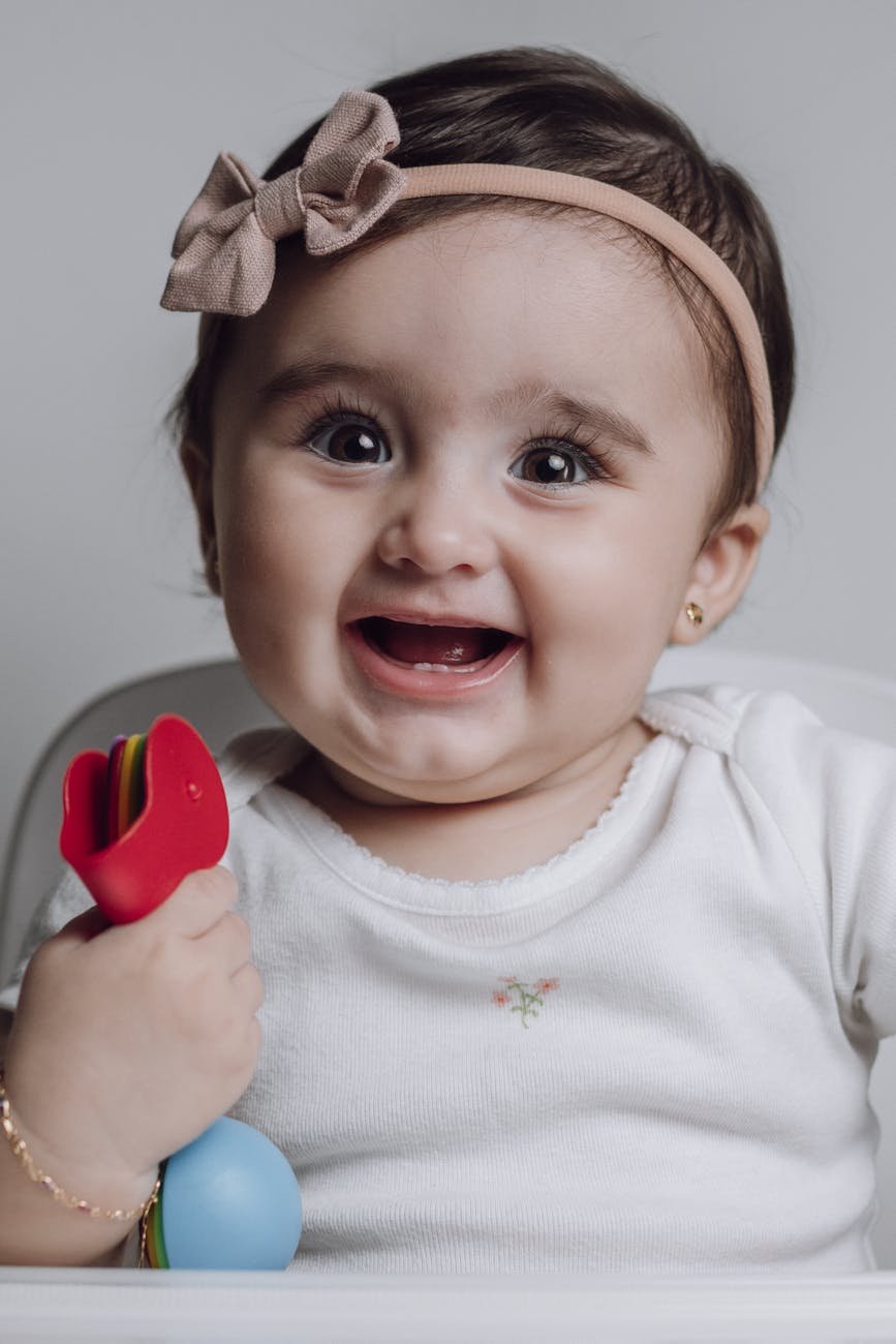 girl sitting on baby chair