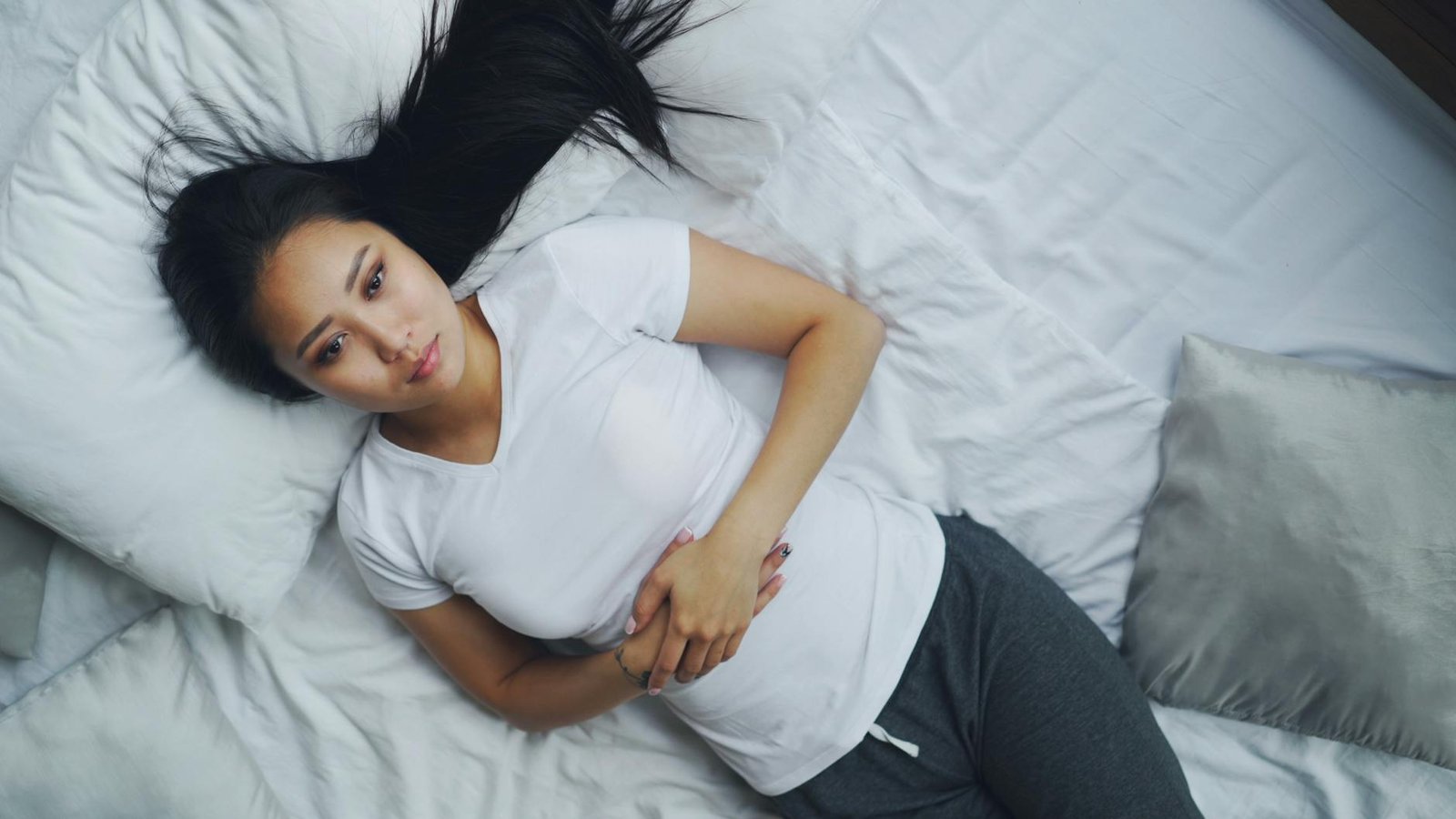 young woman relaxing on a comfortable bed