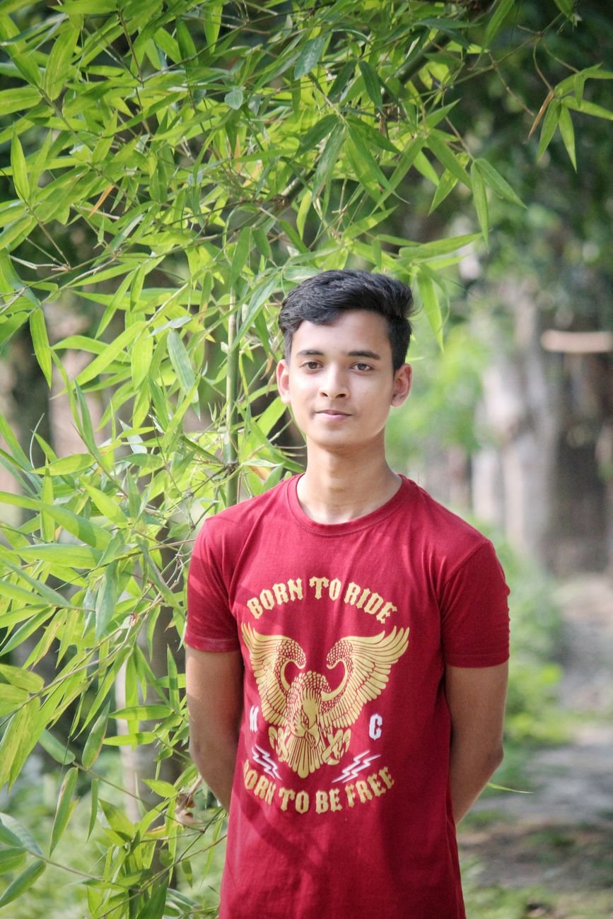 photo of a boy in a red shirt