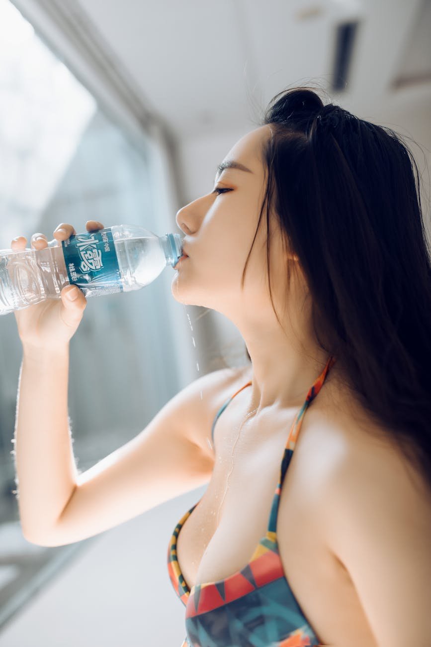 young woman drinking water