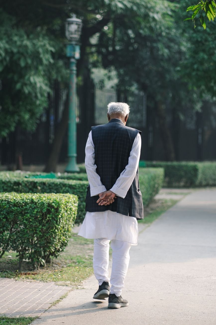 elderly man walking at park
