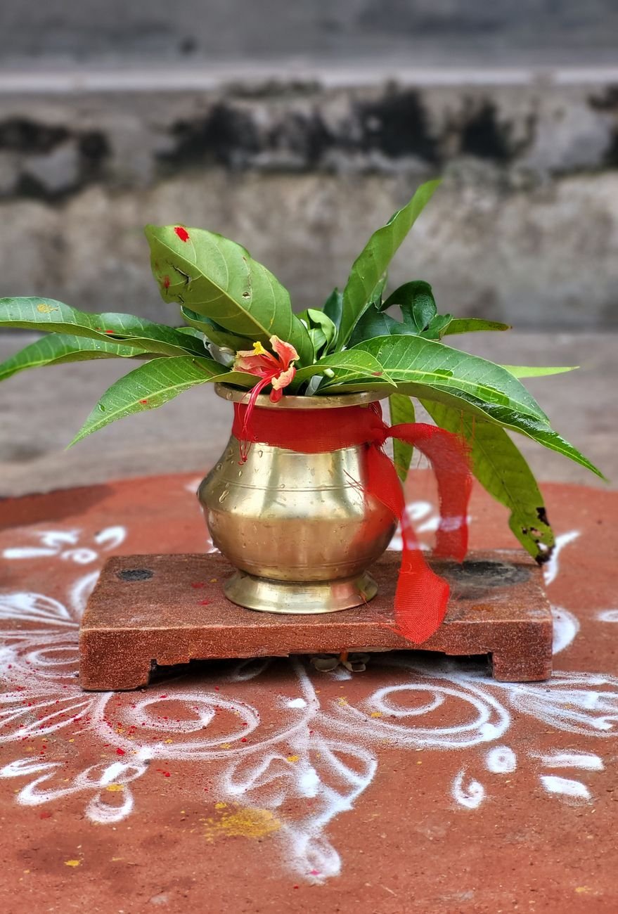 traditional brass pot with floral decoration
