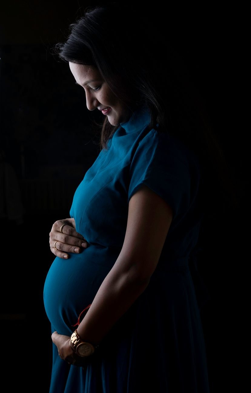 expectant mother in thoughtful pose