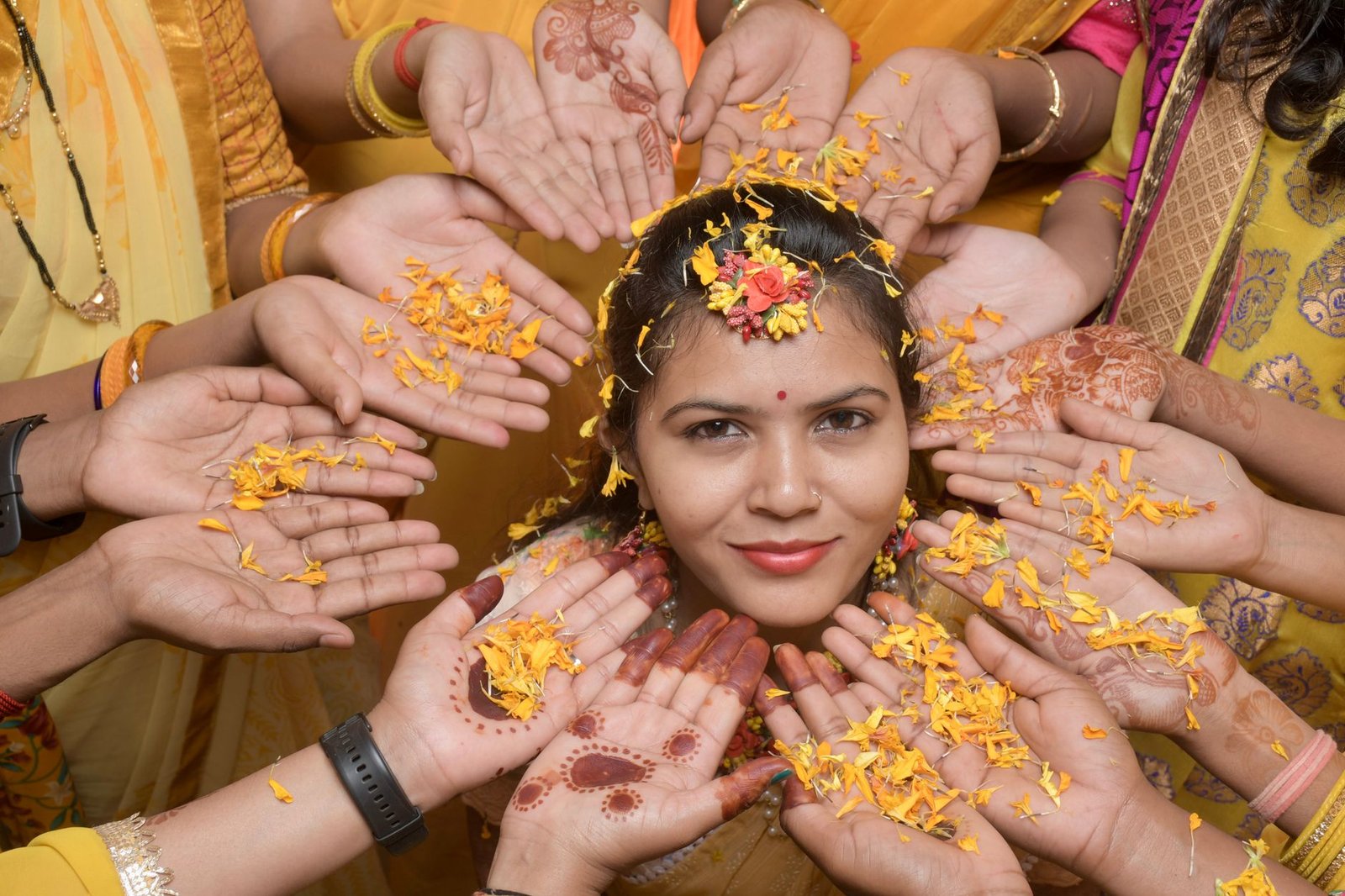 vibrant indian bride surrounded by floral ritual