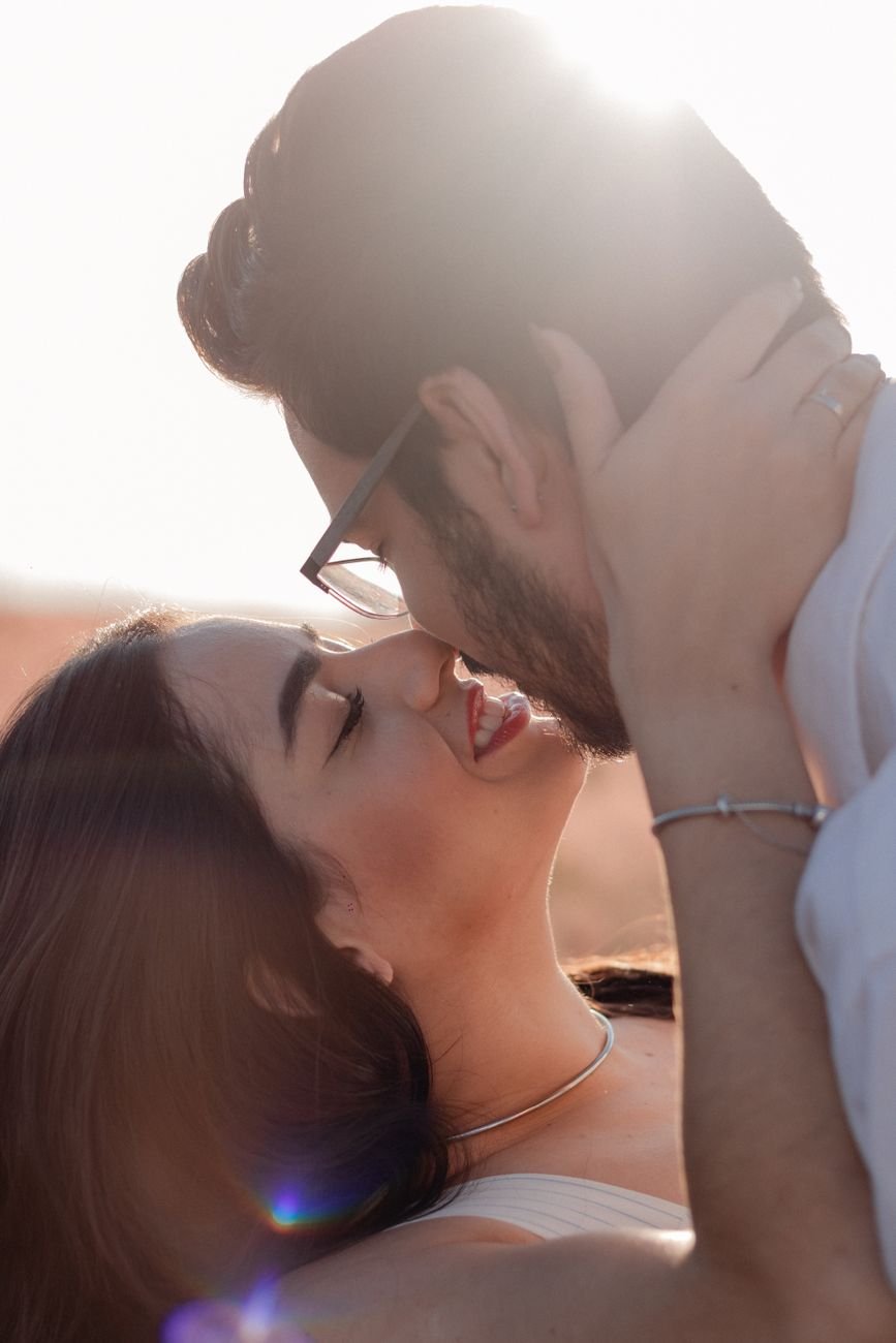 romantic couple embracing outdoors at sunset