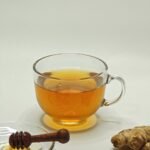 ginger honey tea in a glass cup