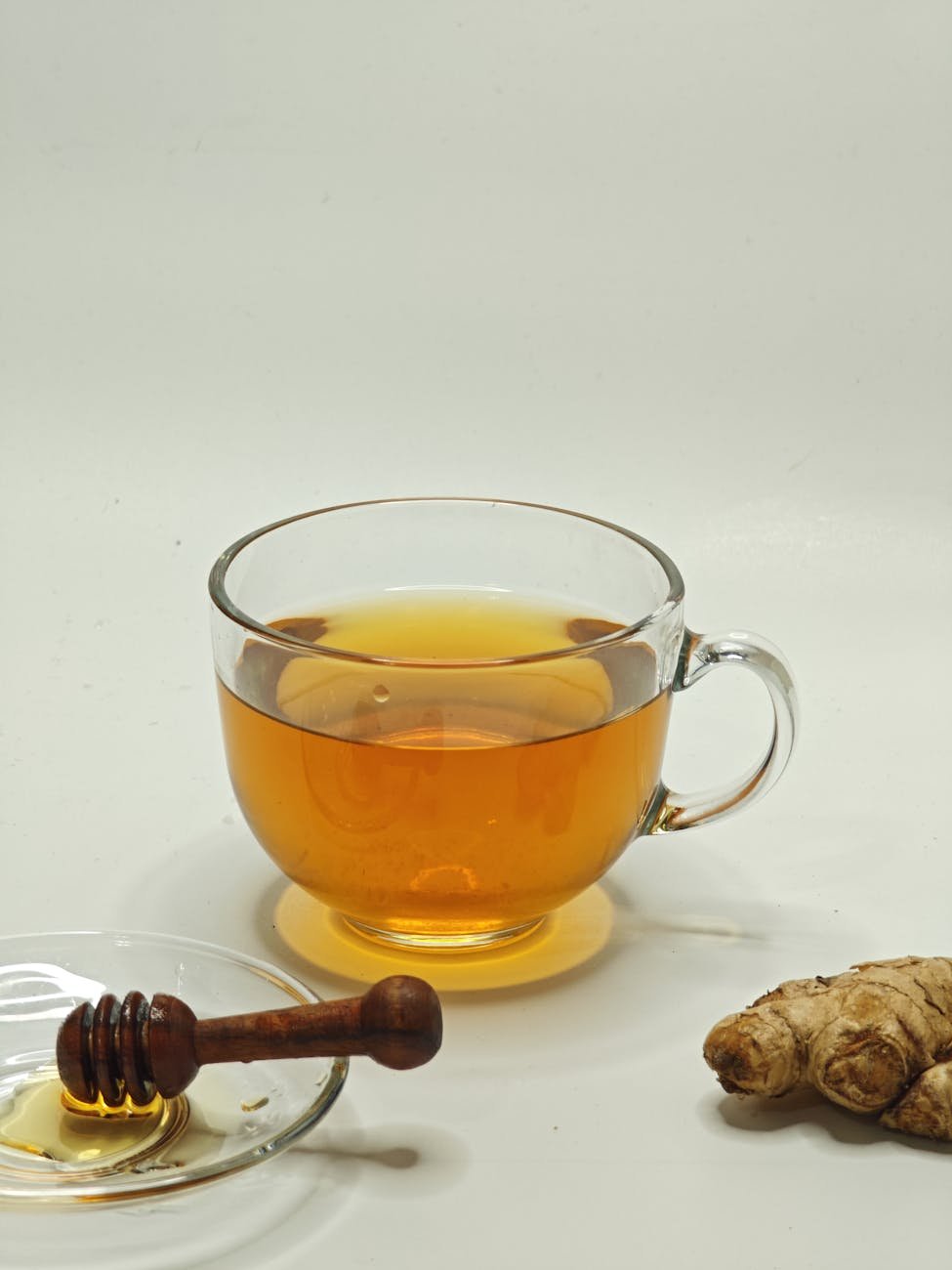 ginger honey tea in a glass cup