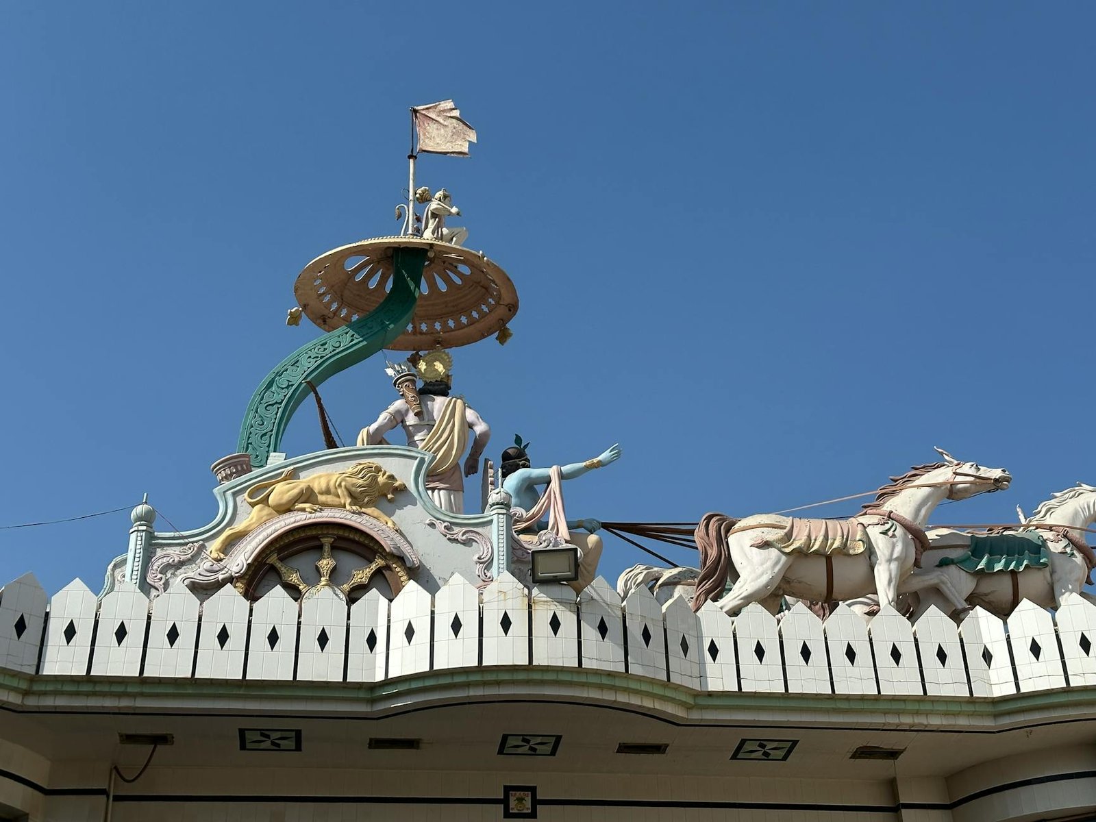 decorative temple architecture with deities and horses