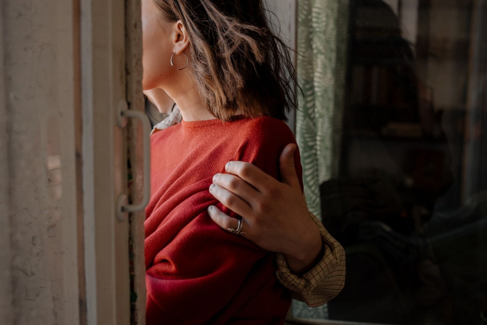 woman in red sweater and brown cardigan