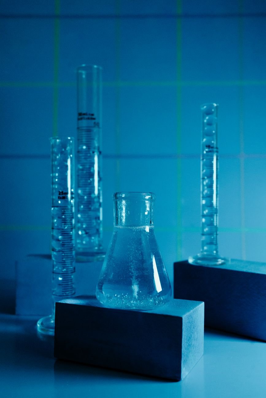 clear glass bottle on table