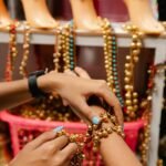 a person wearing gold beaded bracelet