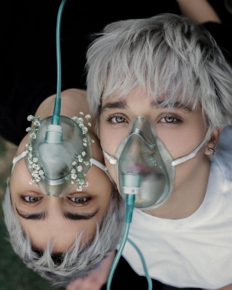 portrait of women wearing oxygen masks