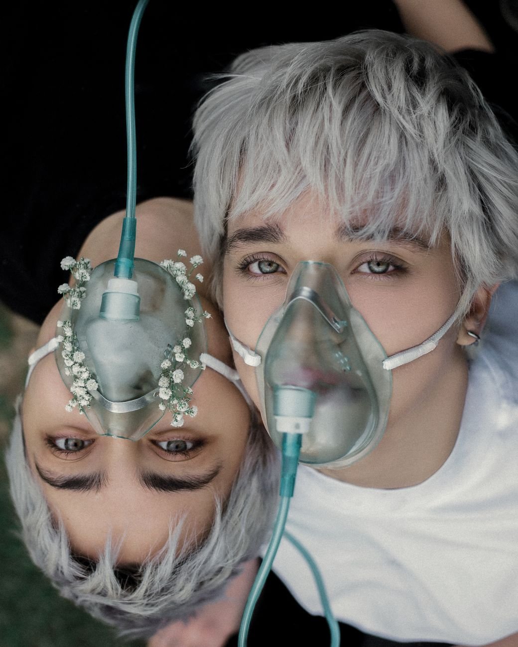 portrait of women wearing oxygen masks