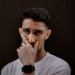 man posing in white t shirt