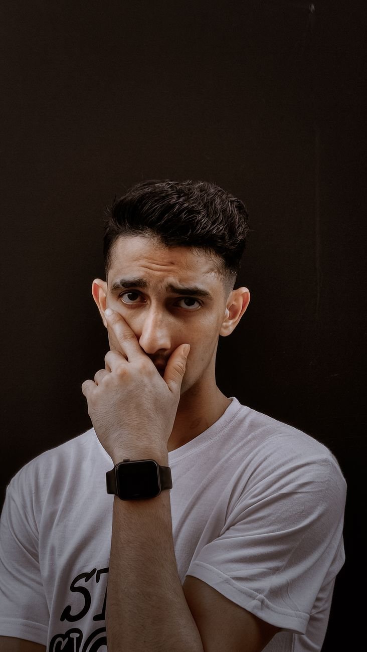 man posing in white t shirt