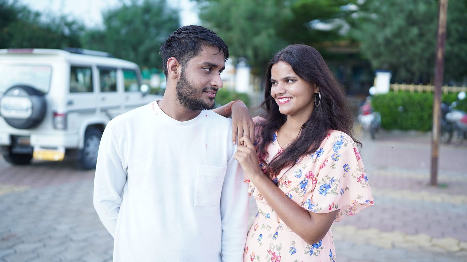 a man and woman standing next to each other