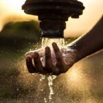 water pouring on pipe