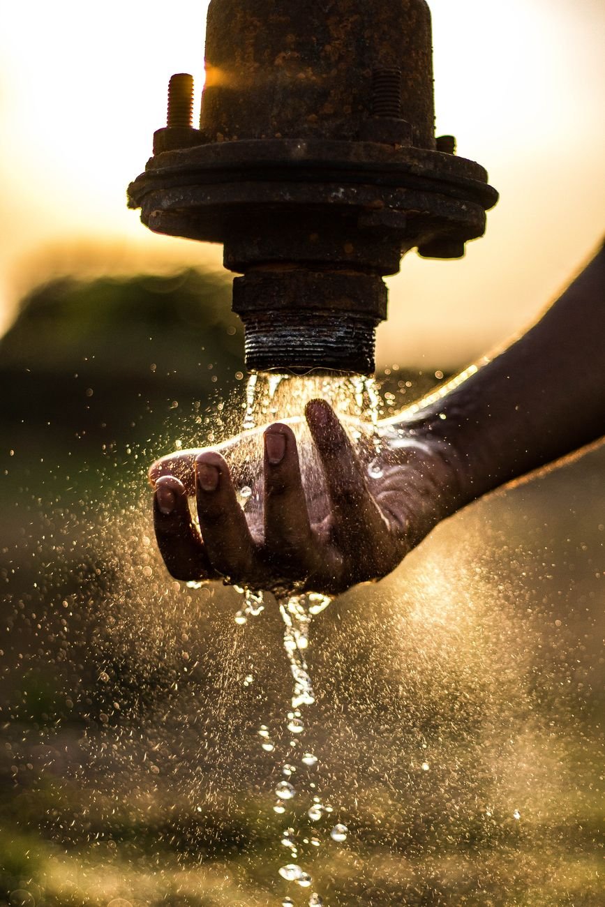 water pouring on pipe