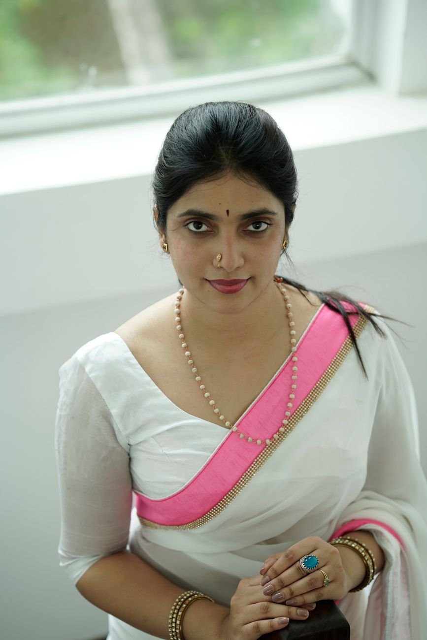 elegant woman in traditional white saree