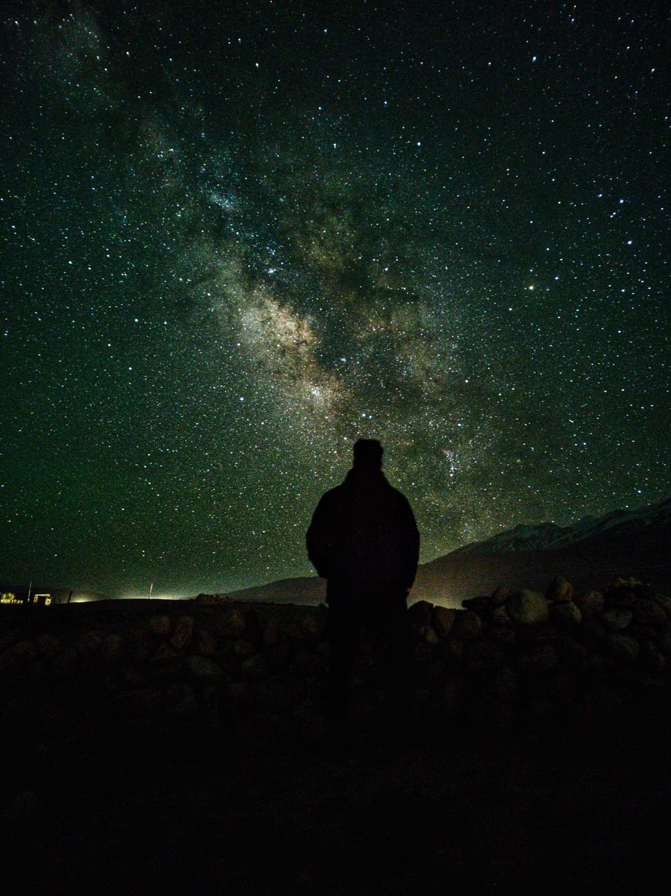 silhouette under a starry sky