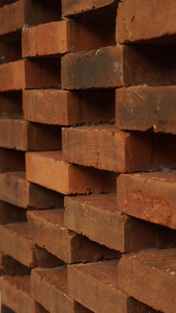 stack of red bricks in construction site