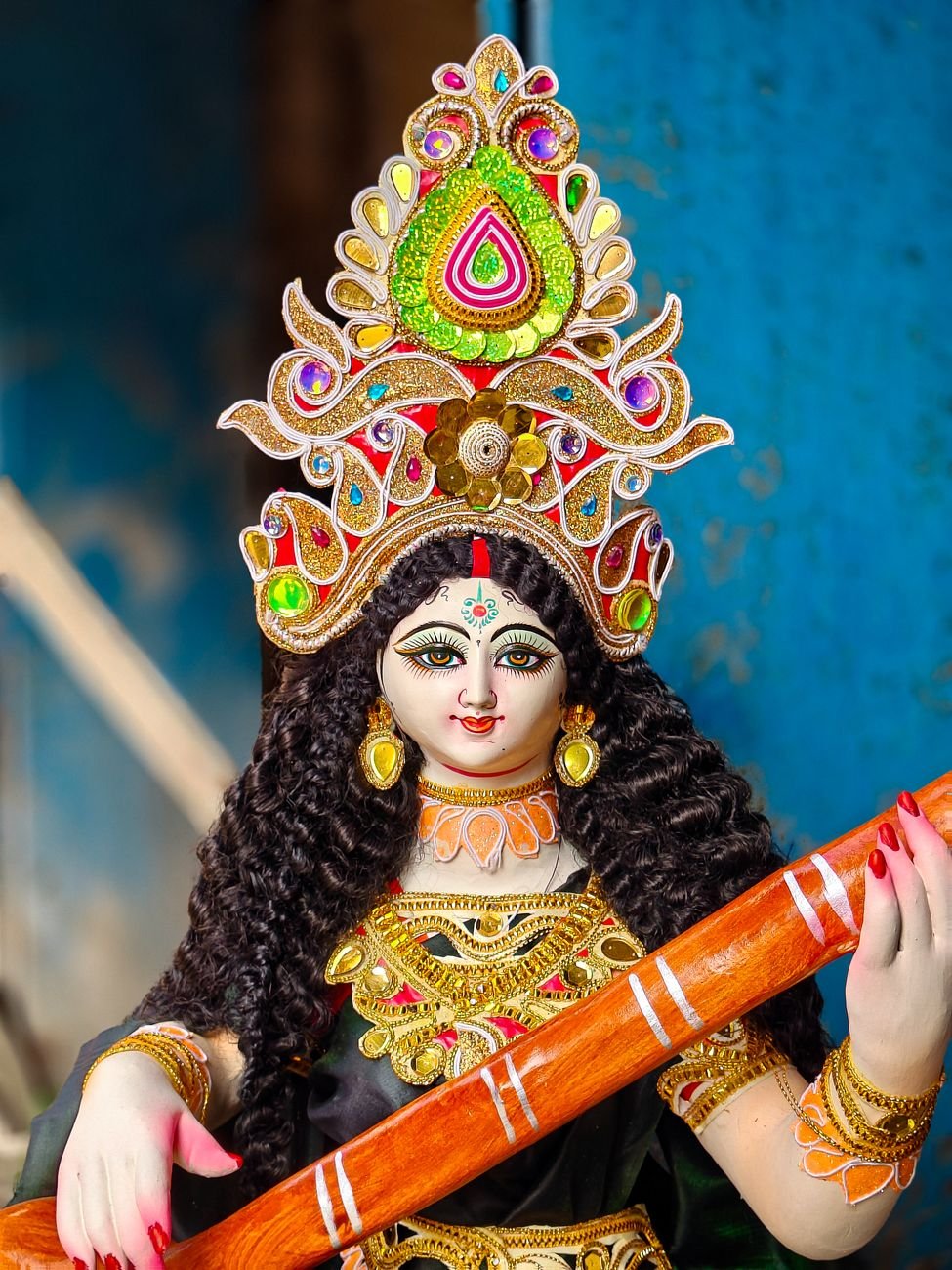 intricate statue of hindu goddess saraswati