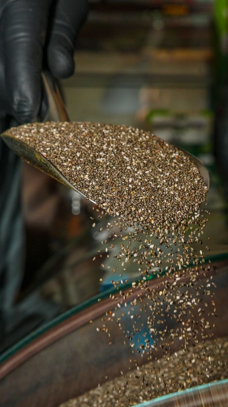 pouring flaxseed from metal scoop