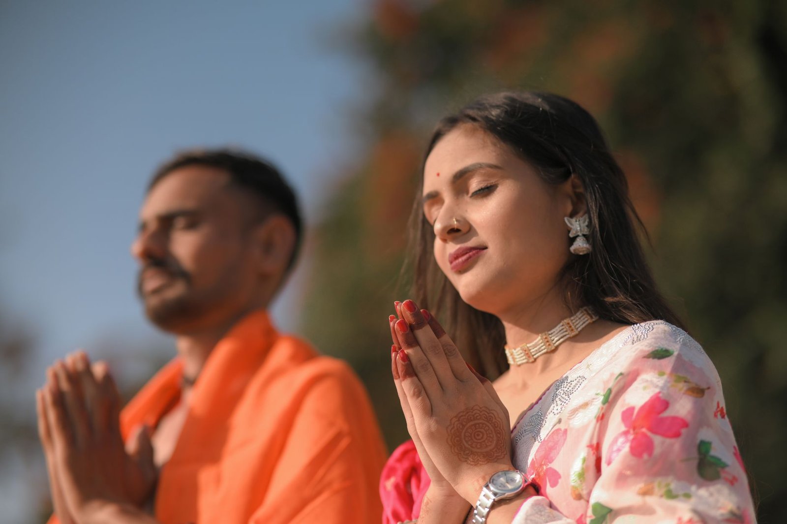 serene couple meditating outdoors