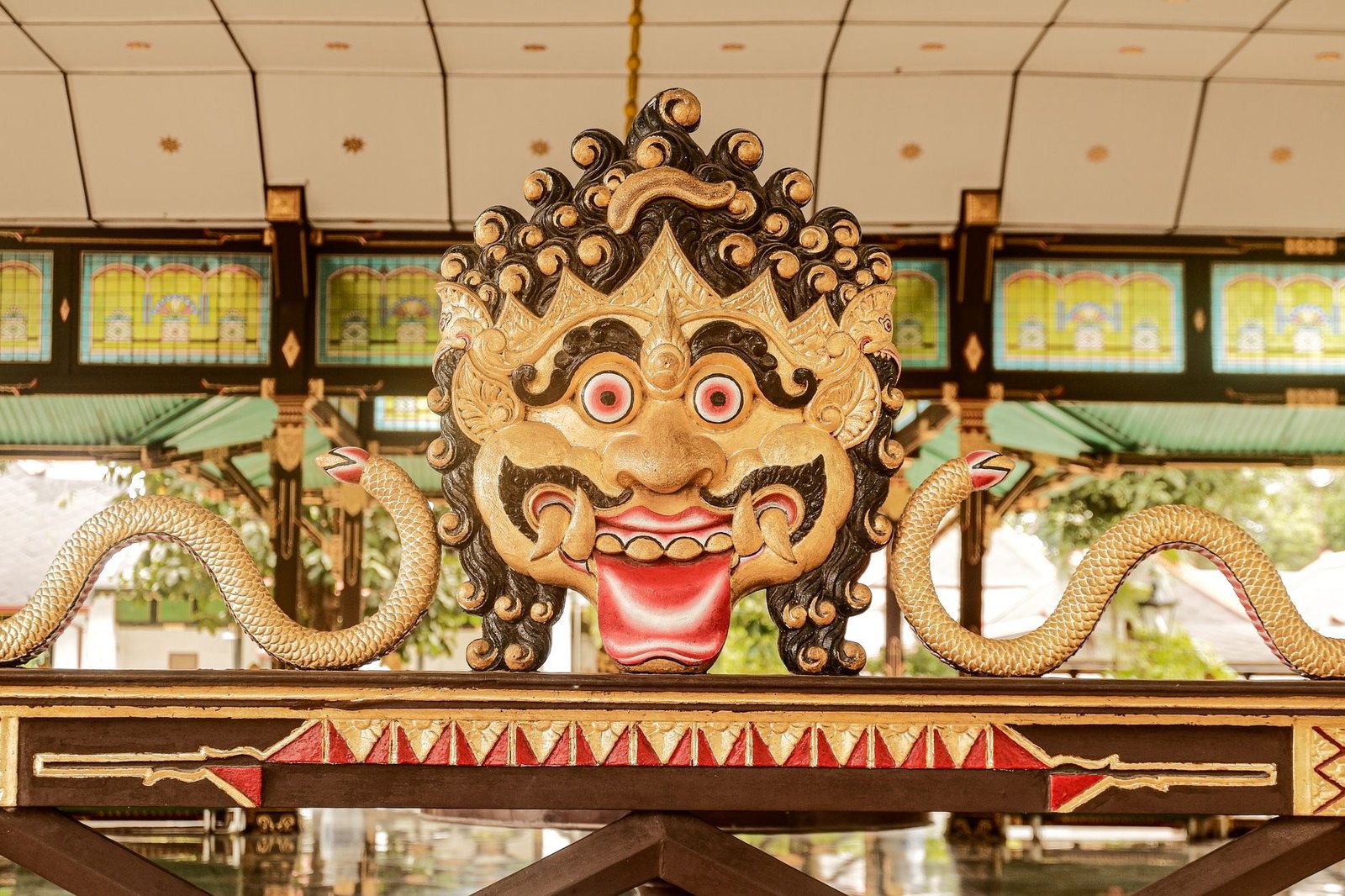 intricate balinese barong mask display indoors
