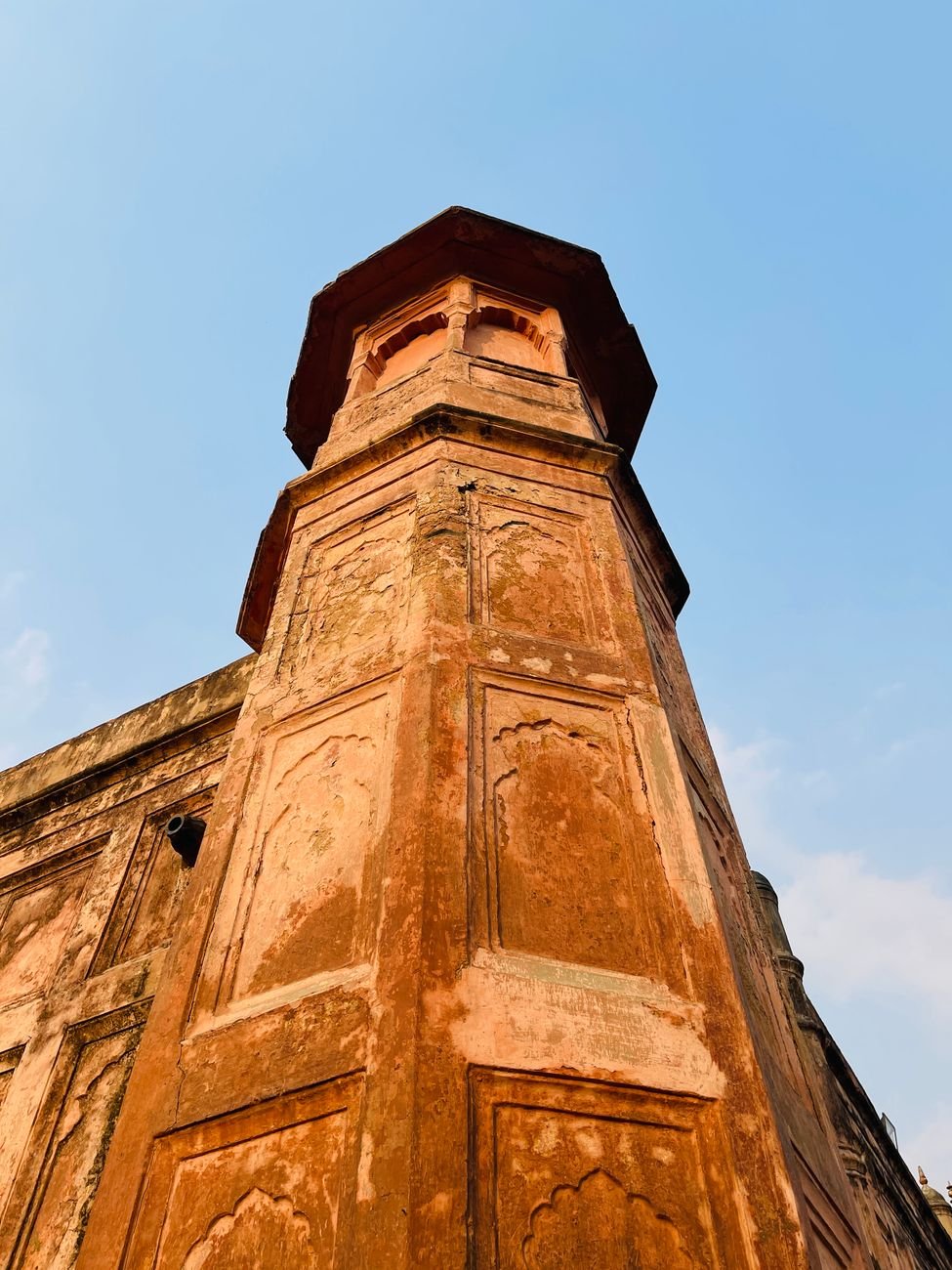 ancient brick tower with blue sky background
