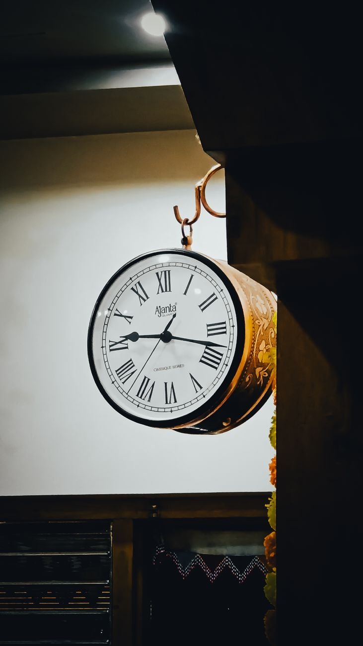 vintage wall clock with roman numerals