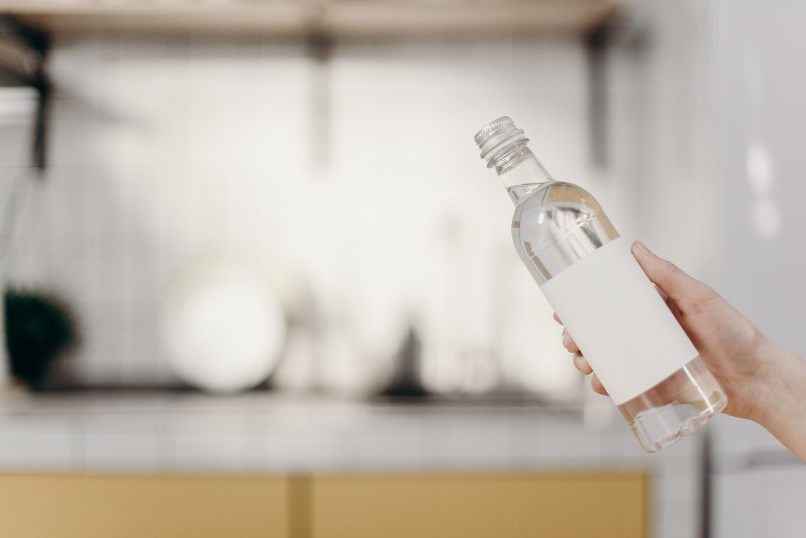 clear glass bottle with white cap