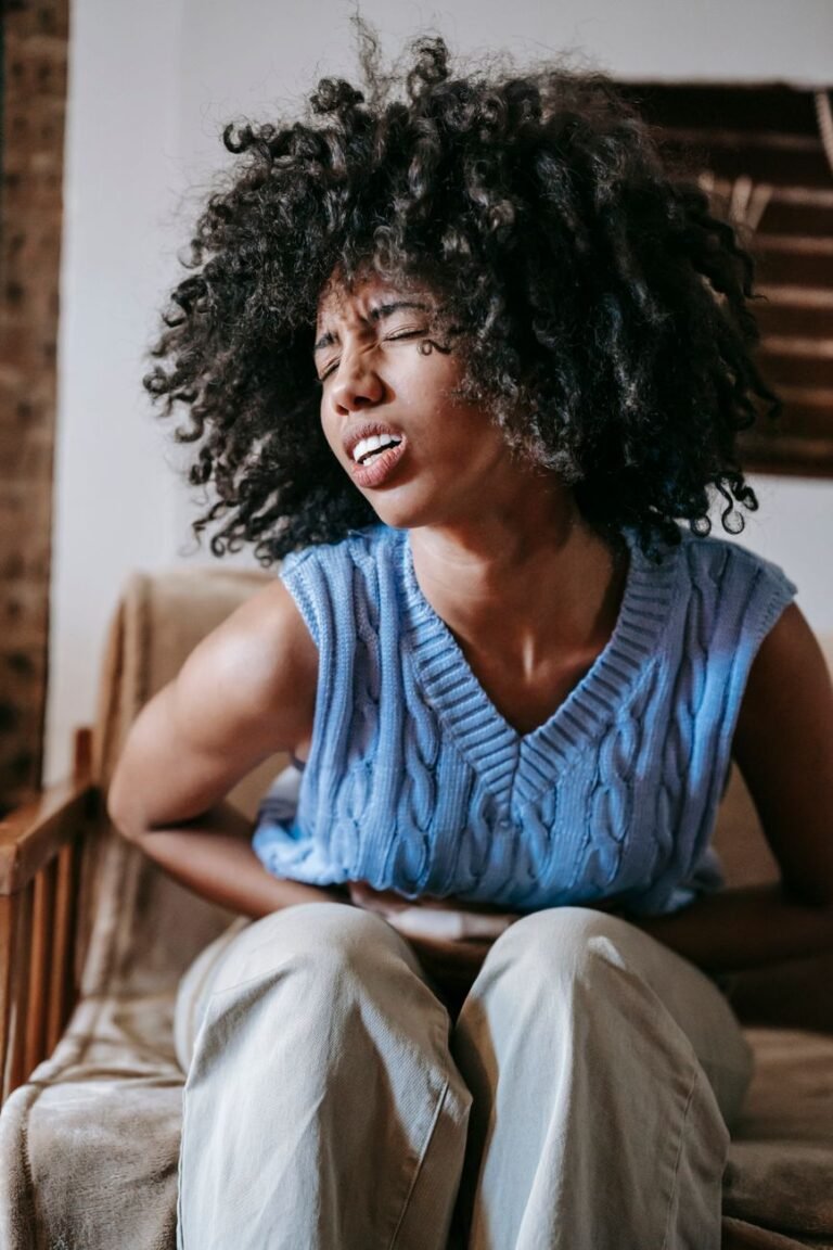 woman suffering from a stomach pain
