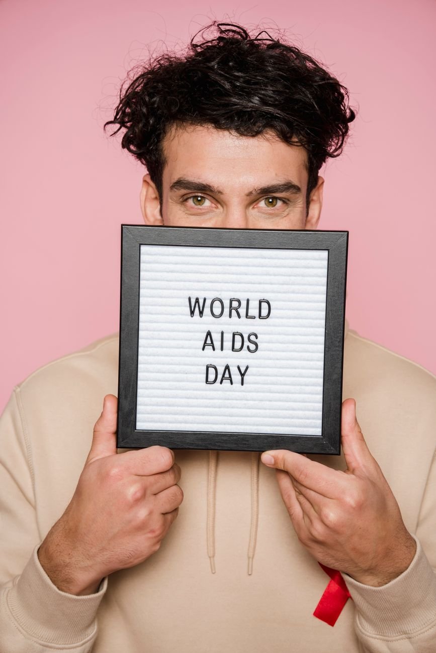 man holding a frame with words on it