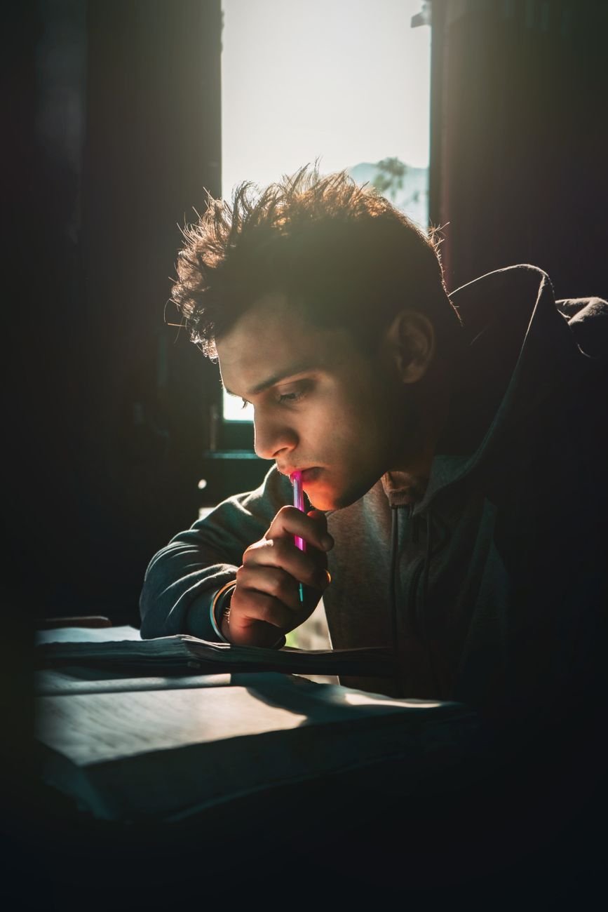 young man sitting and reading