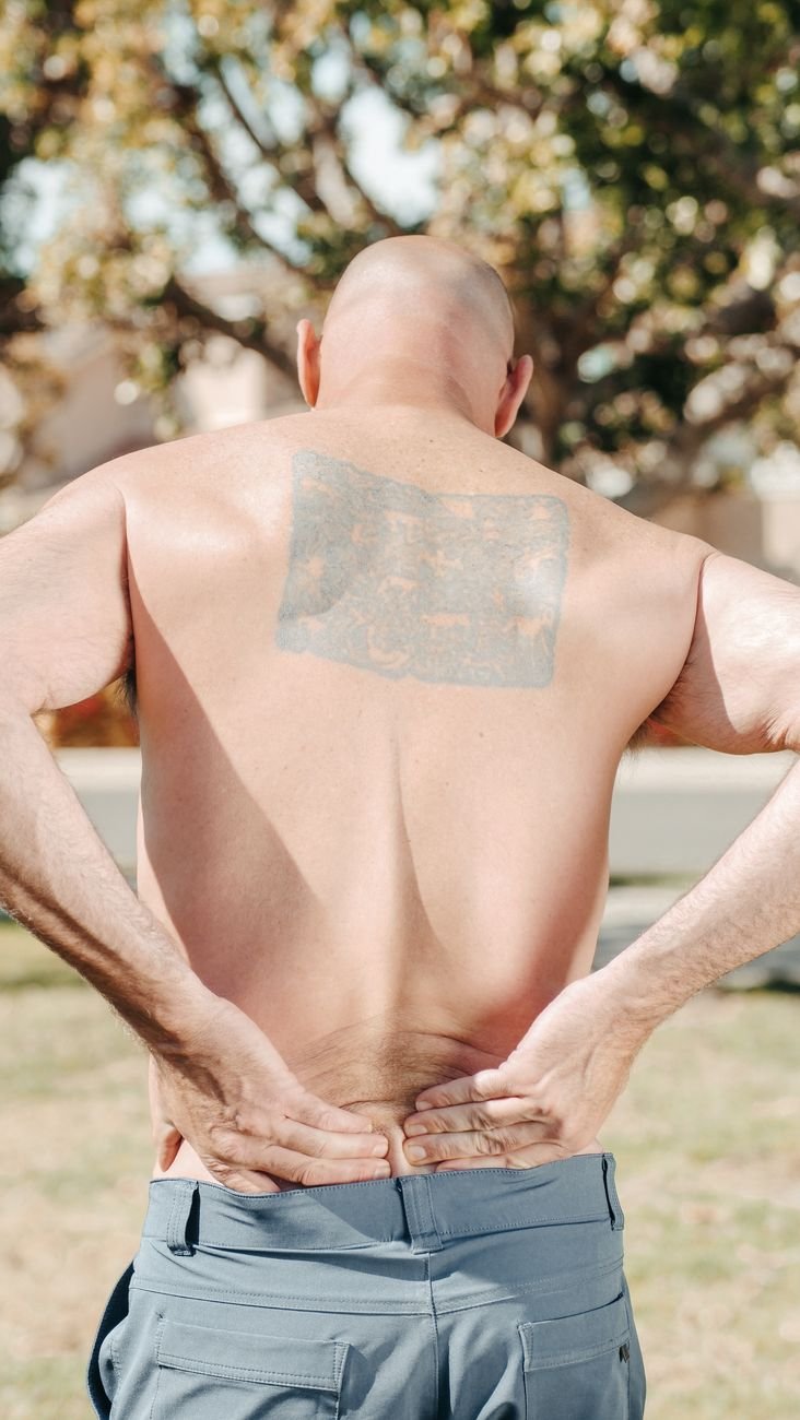 tattoo at the back of a shirtless man