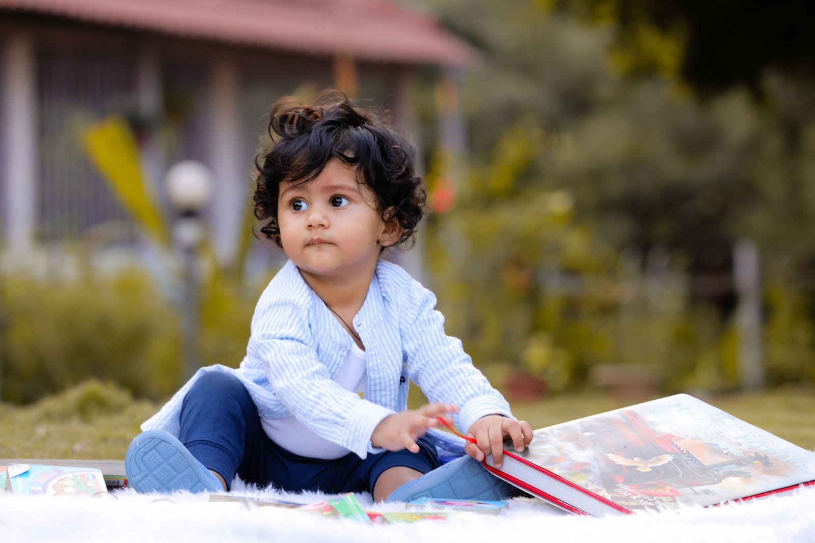 a child sitting outdoors