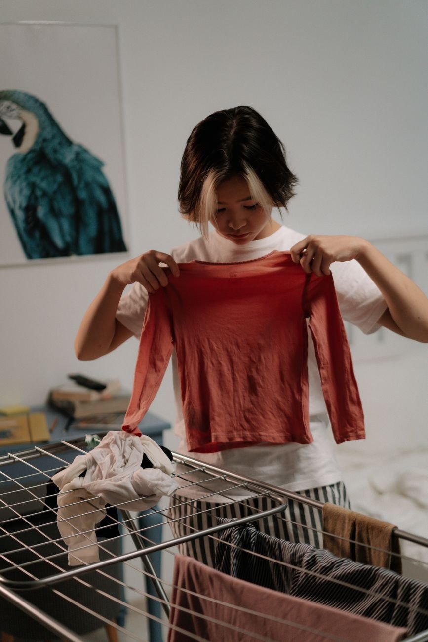 woman hanging clothes