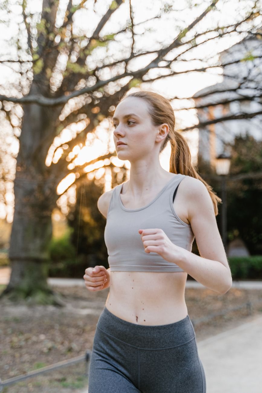 a woman jogging on the street