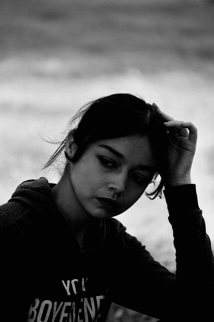 portrait of a pretty brunette wearing a nose ring