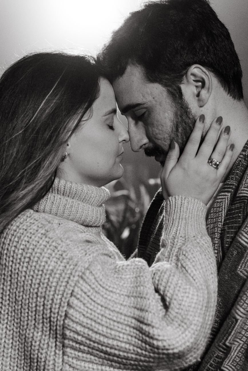black and white photo of a cuddling couple