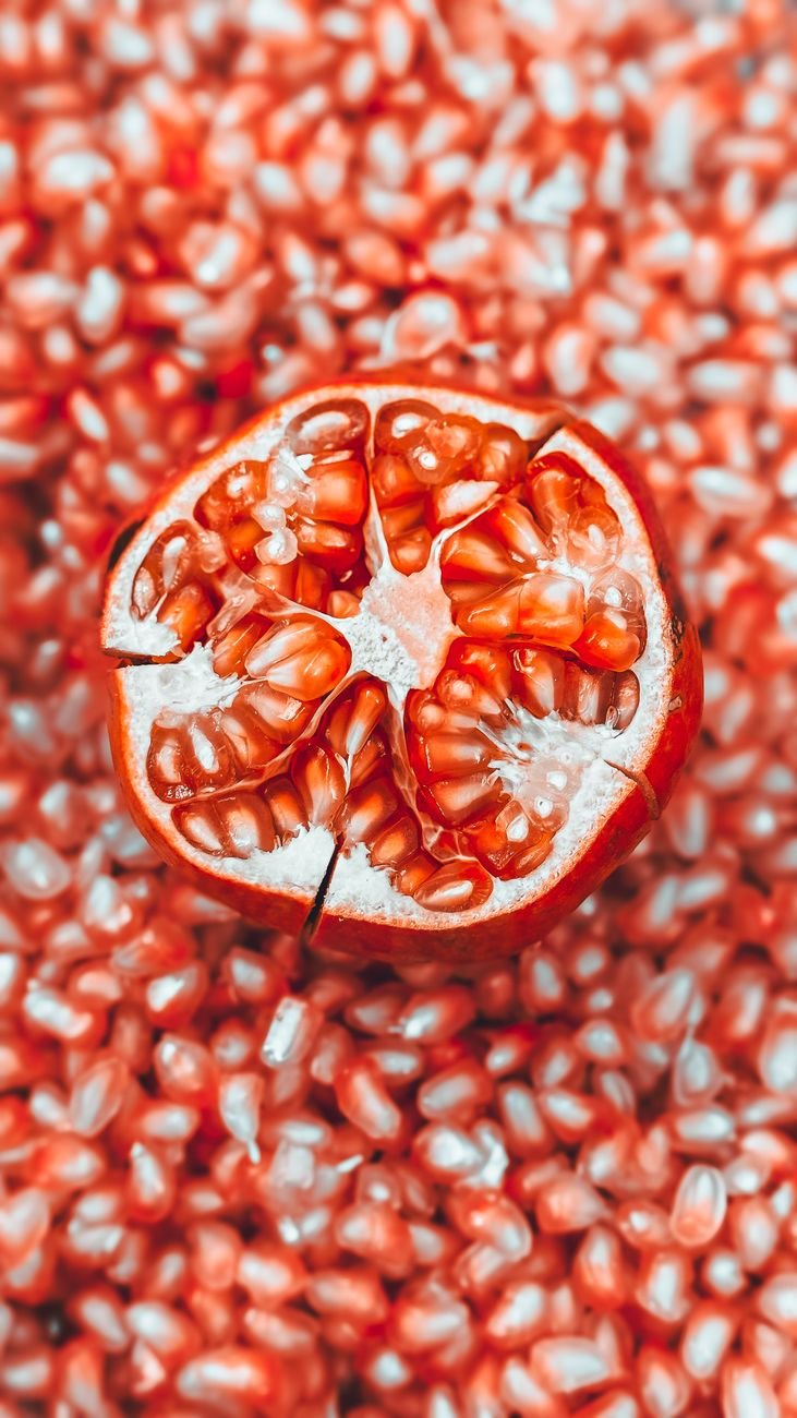 open pomegranate on its grains
