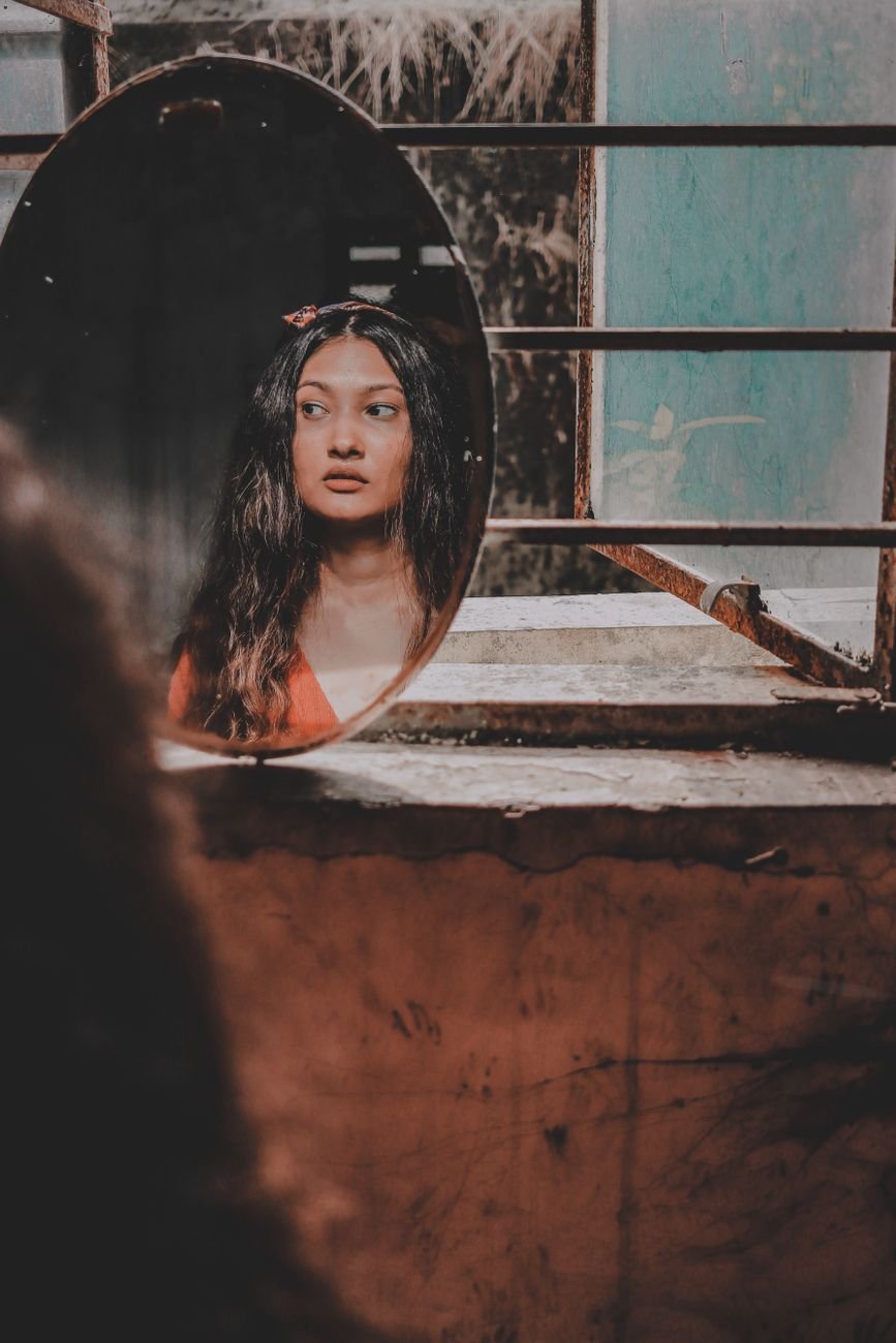 reflection of a woman from a mirror