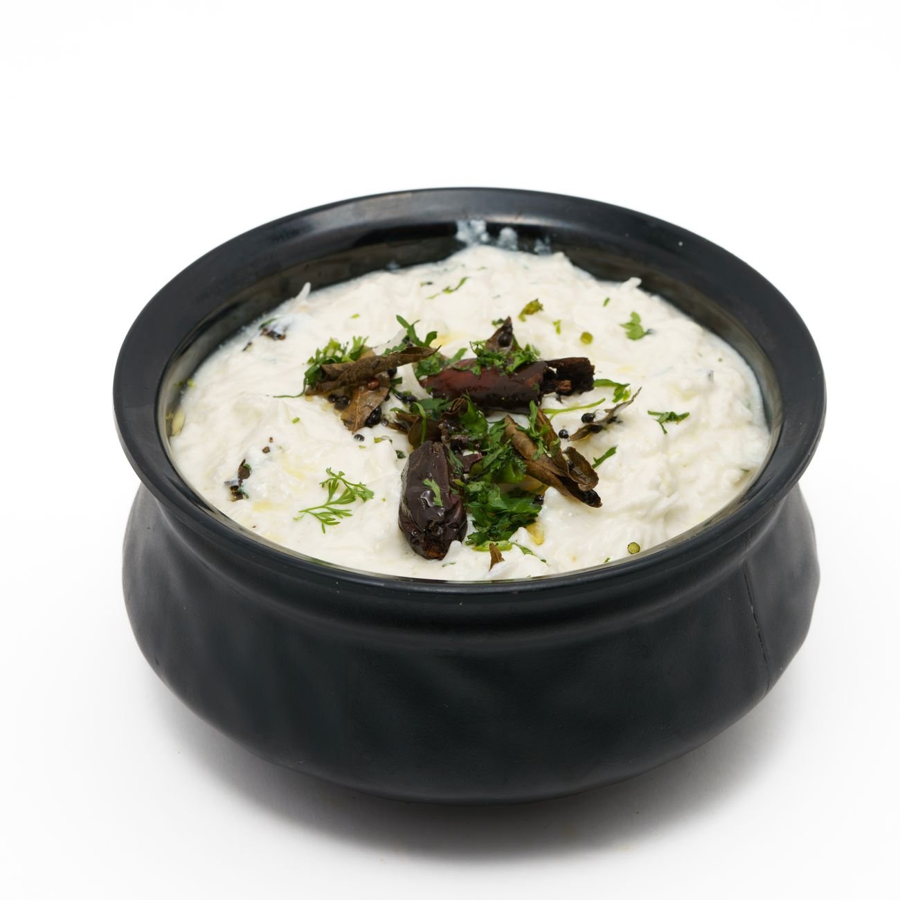 creamy curd rice in black ceramic bowl
