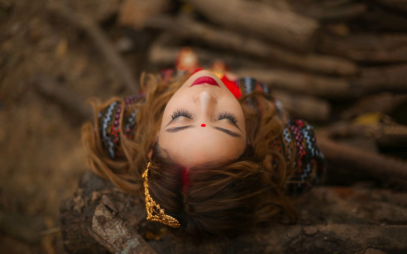 woman leaning on tree