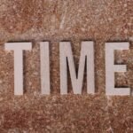 time spelled on textured background