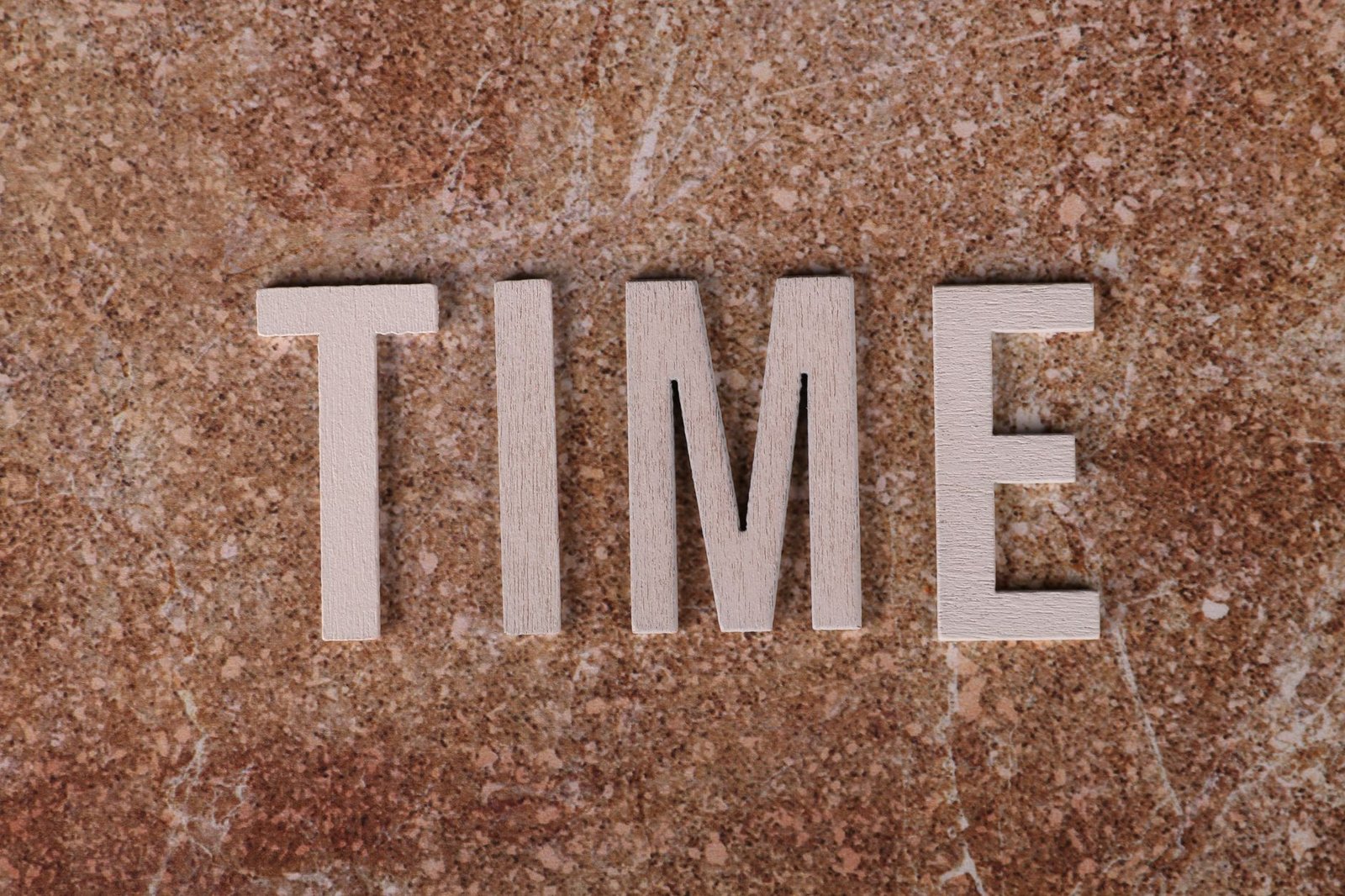 time spelled on textured background