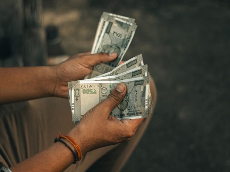 indian rupees in hands symbolizing wealth