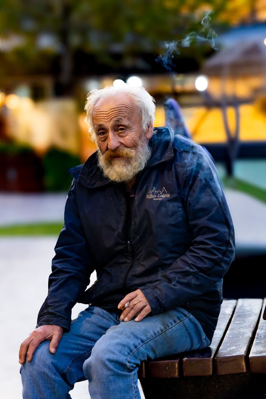 elderly man in park during twilight
