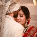 photo of man kissing woman s forehead